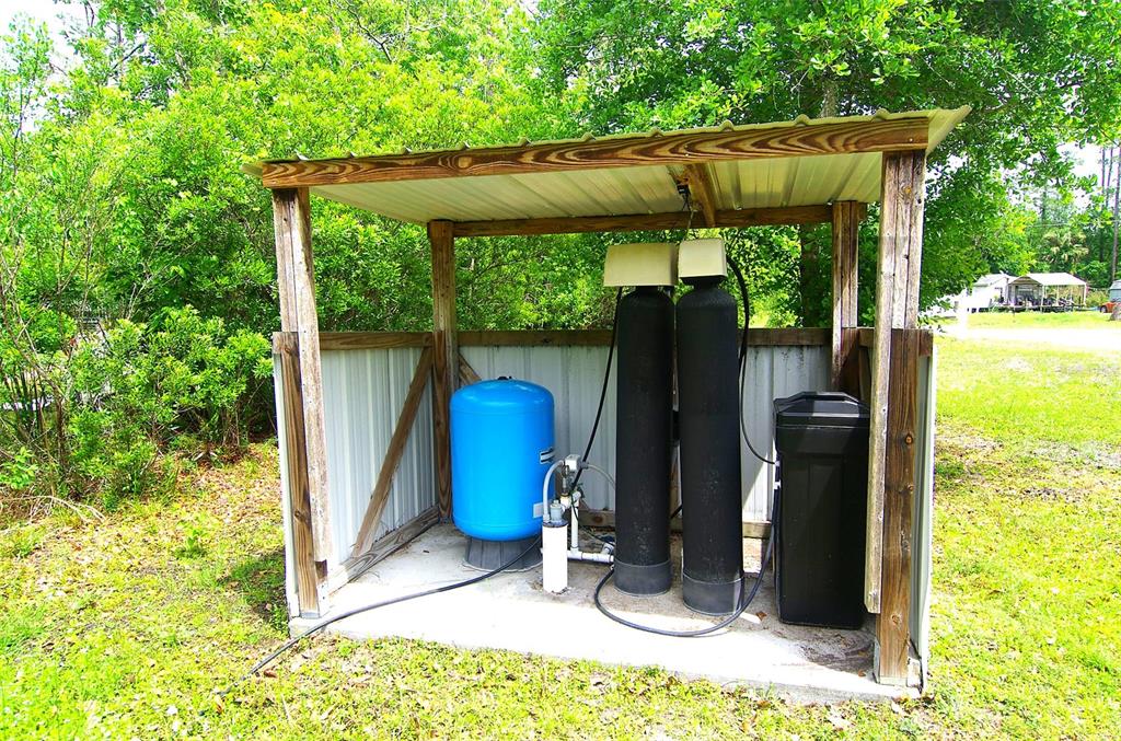 1730 Berrybush Street Bunnell, FL 32110 - Photo 39 of 43 a view of a backyard with wooden floor and outdoor seating