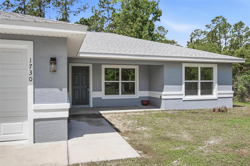 1730 Berrybush Street Bunnell, FL 32110 - Photo 40 of 43 a house view with a outdoor space