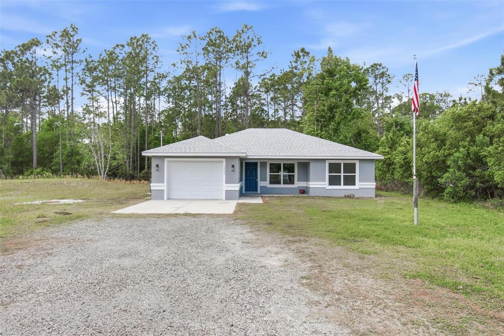 1730 Berrybush Street Bunnell, FL 32110 - Photo 43 of 43 a house with trees in the background