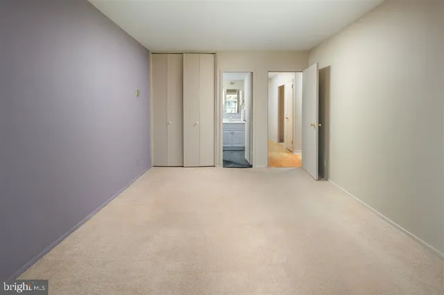 a view of an empty room and a window