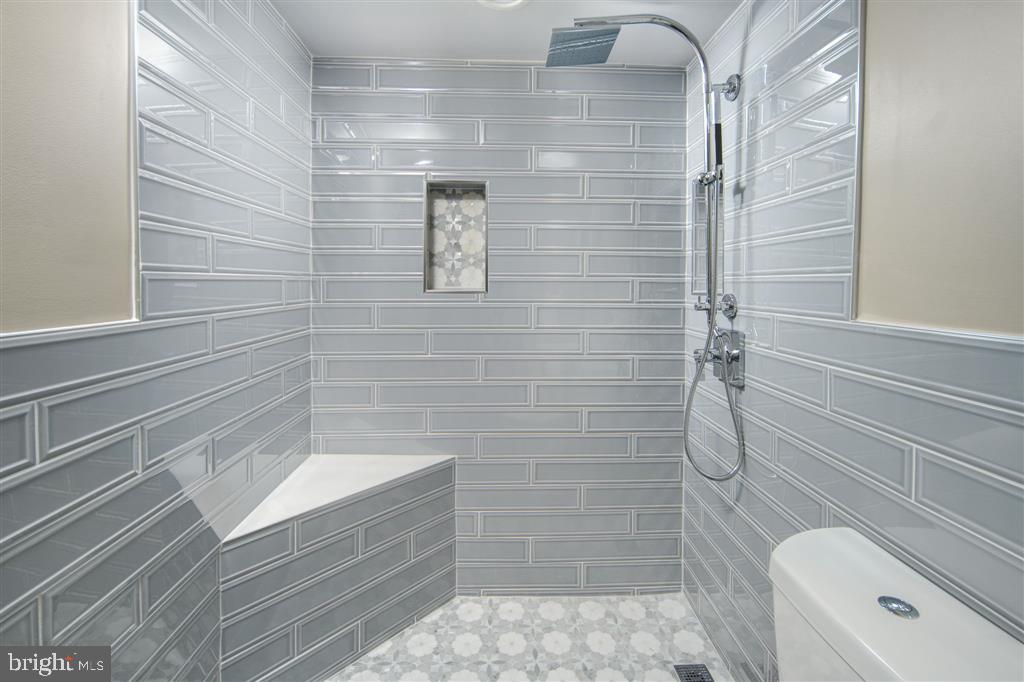 1425 4th Street Southwest, Unit A712 Washington, DC 20024 - Photo 16 of 38 a bathroom with a shower and a toilet