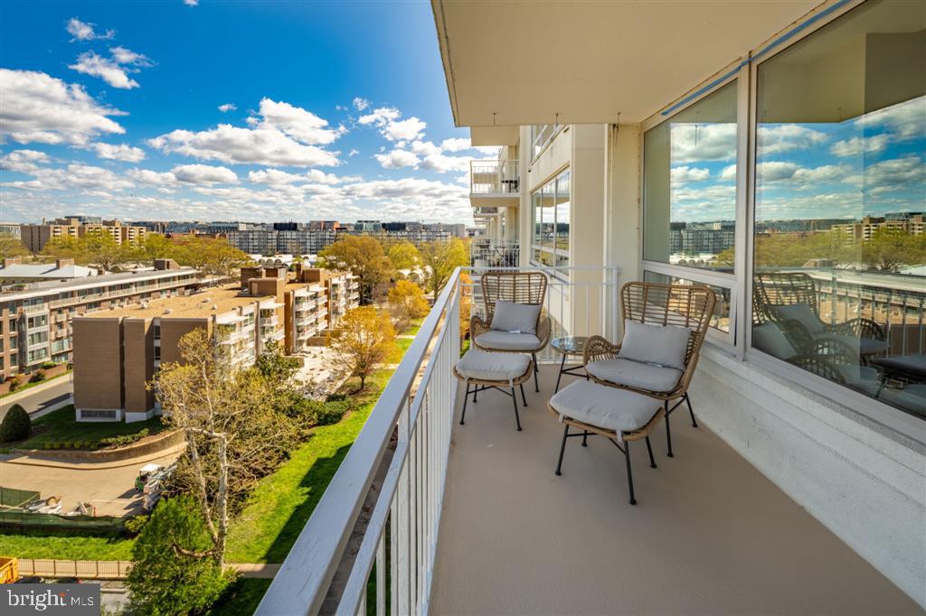 1425 4th Street Southwest, Unit A712 Washington, DC 20024 - Photo 19 of 38 a view of a balcony with chairs