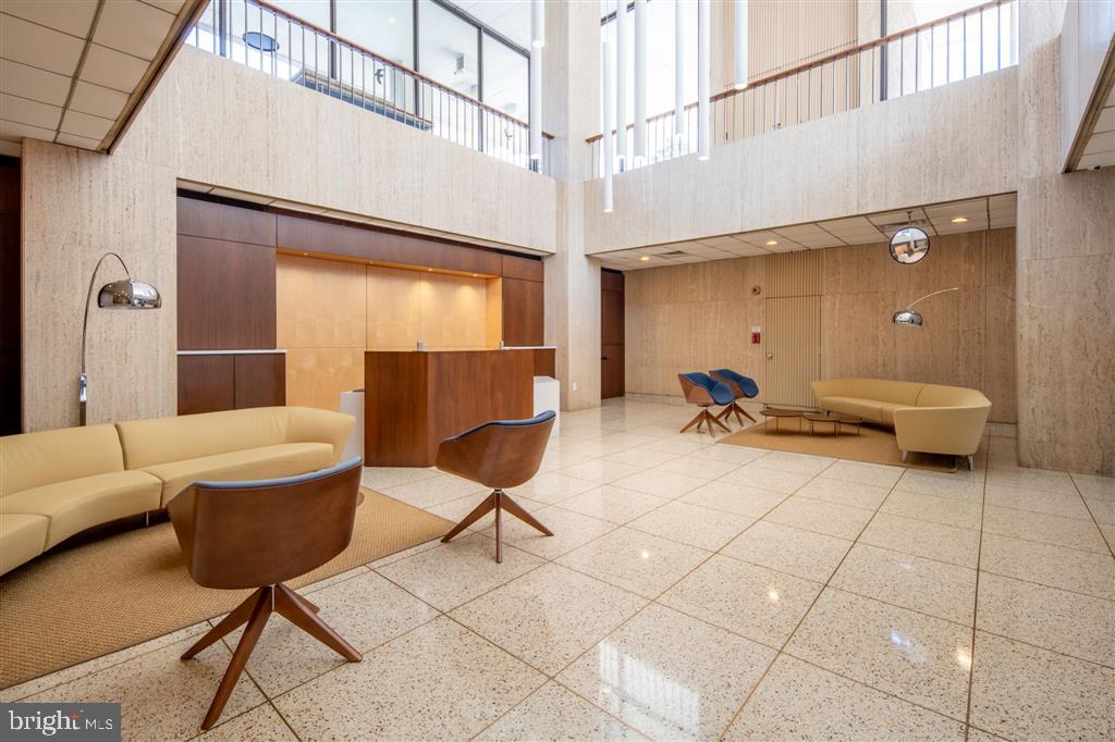 1425 4th Street Southwest, Unit A712 Washington, DC 20024 - Photo 21 of 38 a living room with furniture and a window