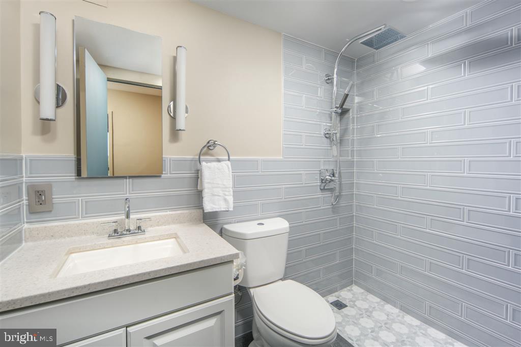 1425 4th Street Southwest, Unit A712 Washington, DC 20024 - Photo 22 of 38 a bathroom with a sink a toilet and shower