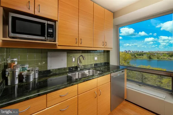 a kitchen with a sink and microwave