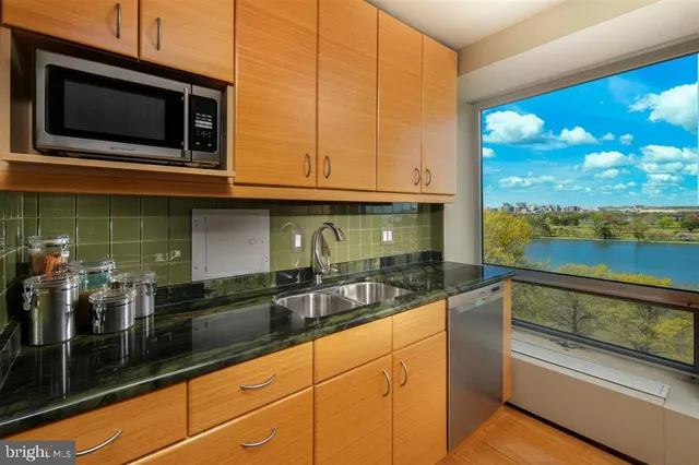 a kitchen with a sink and microwave