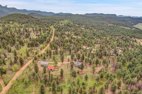 a view of a town with mountains in the background