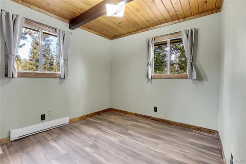 a view of a balcony with wooden floor