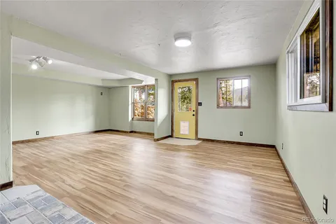 a view of empty space with large trees