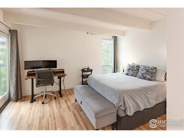 a bedroom with a bed and a table