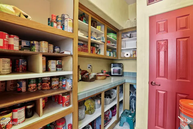 a room with furniture and a book shelf