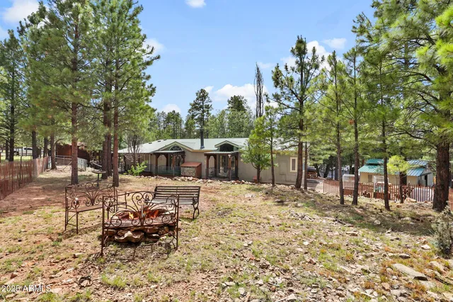 a view of a bench in a backyard