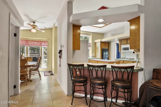 a dining room with furniture and window
