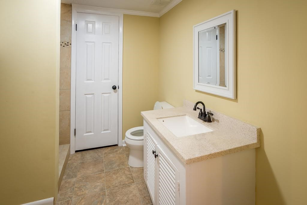 4220 Rowan Street Raleigh, NC 27609 - Photo 18 of 24 3rd Bathroom and Laundry
