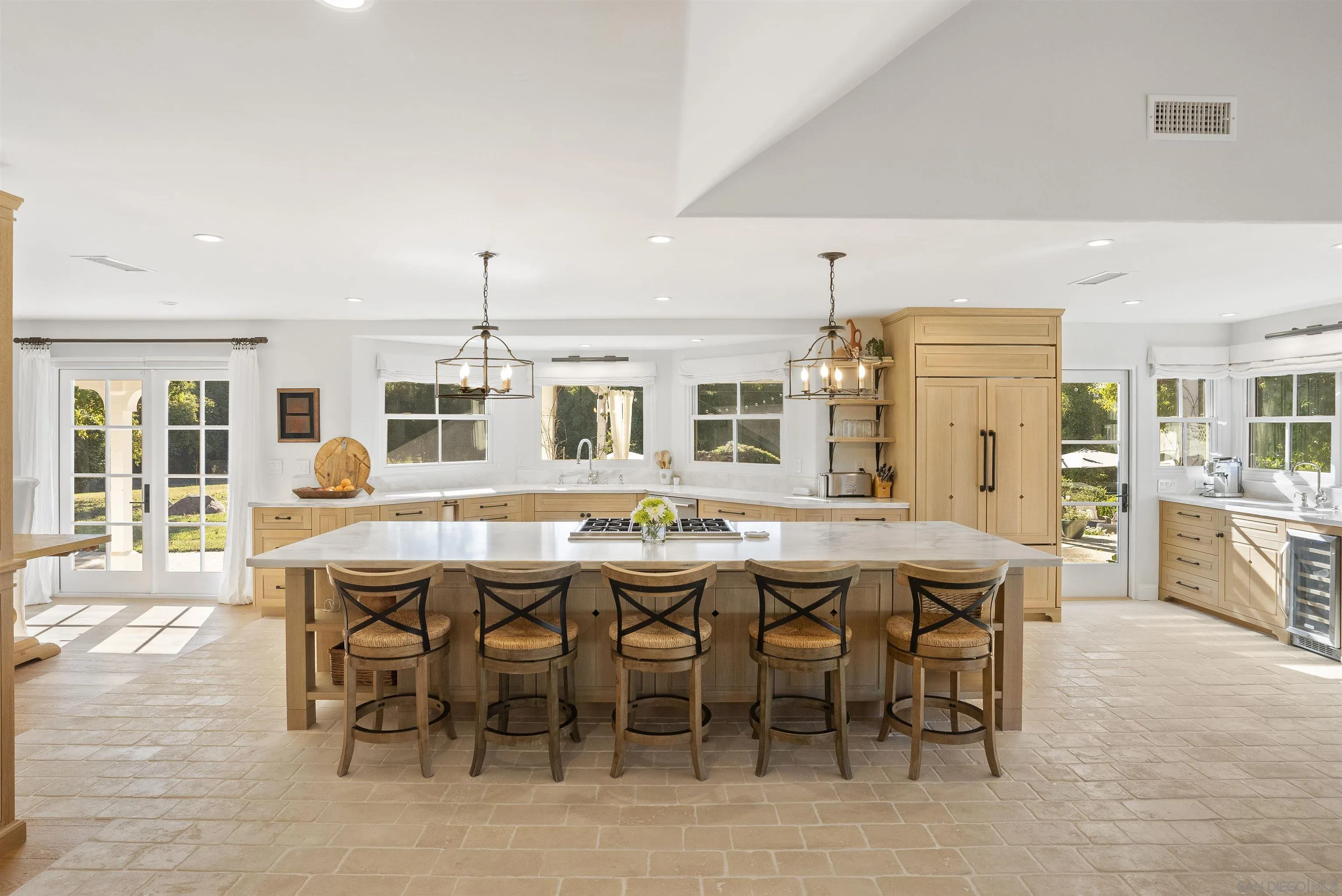 5 Country Glen Road Fallbrook, CA 92028 - Photo 13 of 43 a dining hall with stainless steel appliances kitchen island a table and chairs