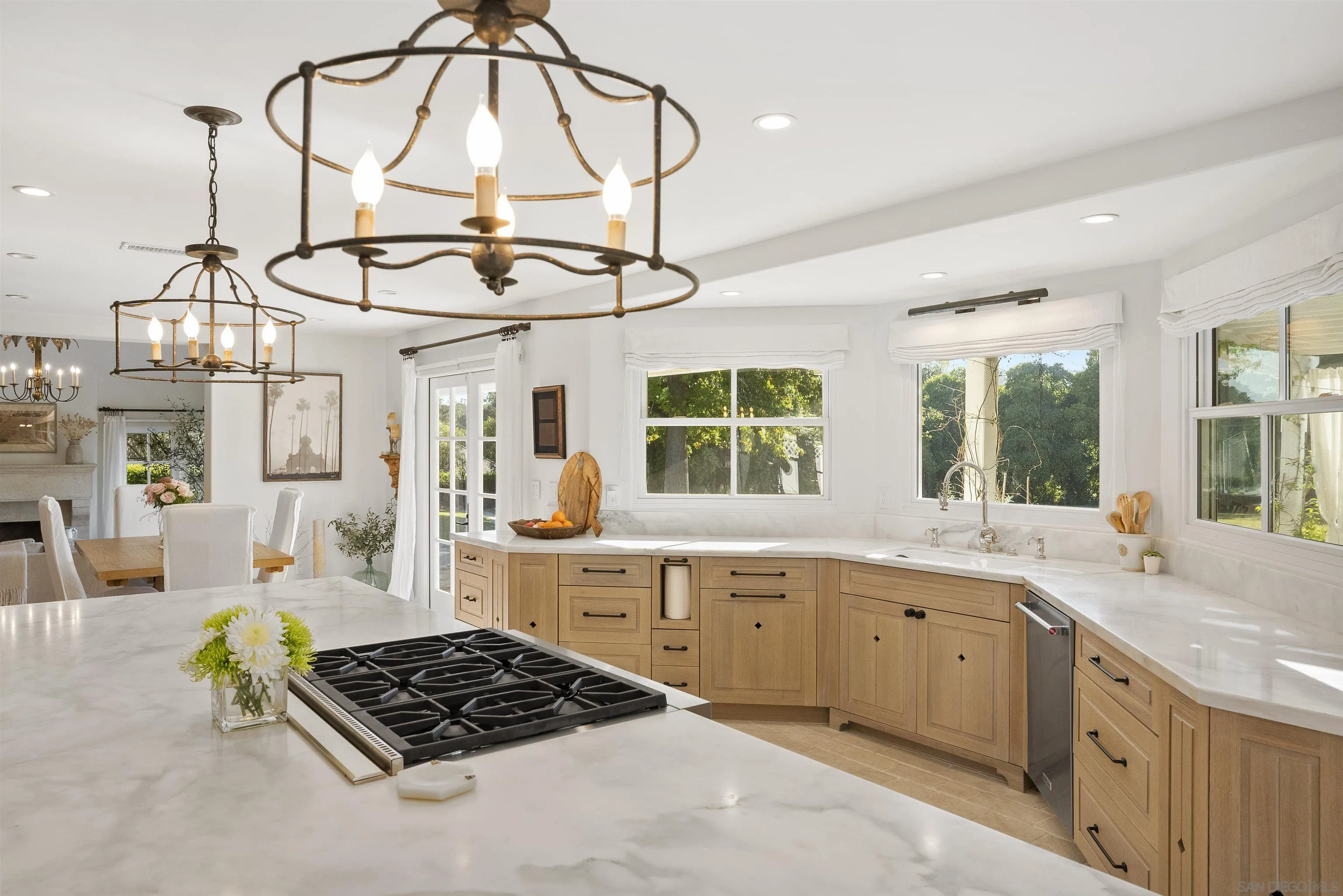 5 Country Glen Road Fallbrook, CA 92028 - Photo 14 of 43 a kitchen that has a lot of cabinets in it and wooden floors