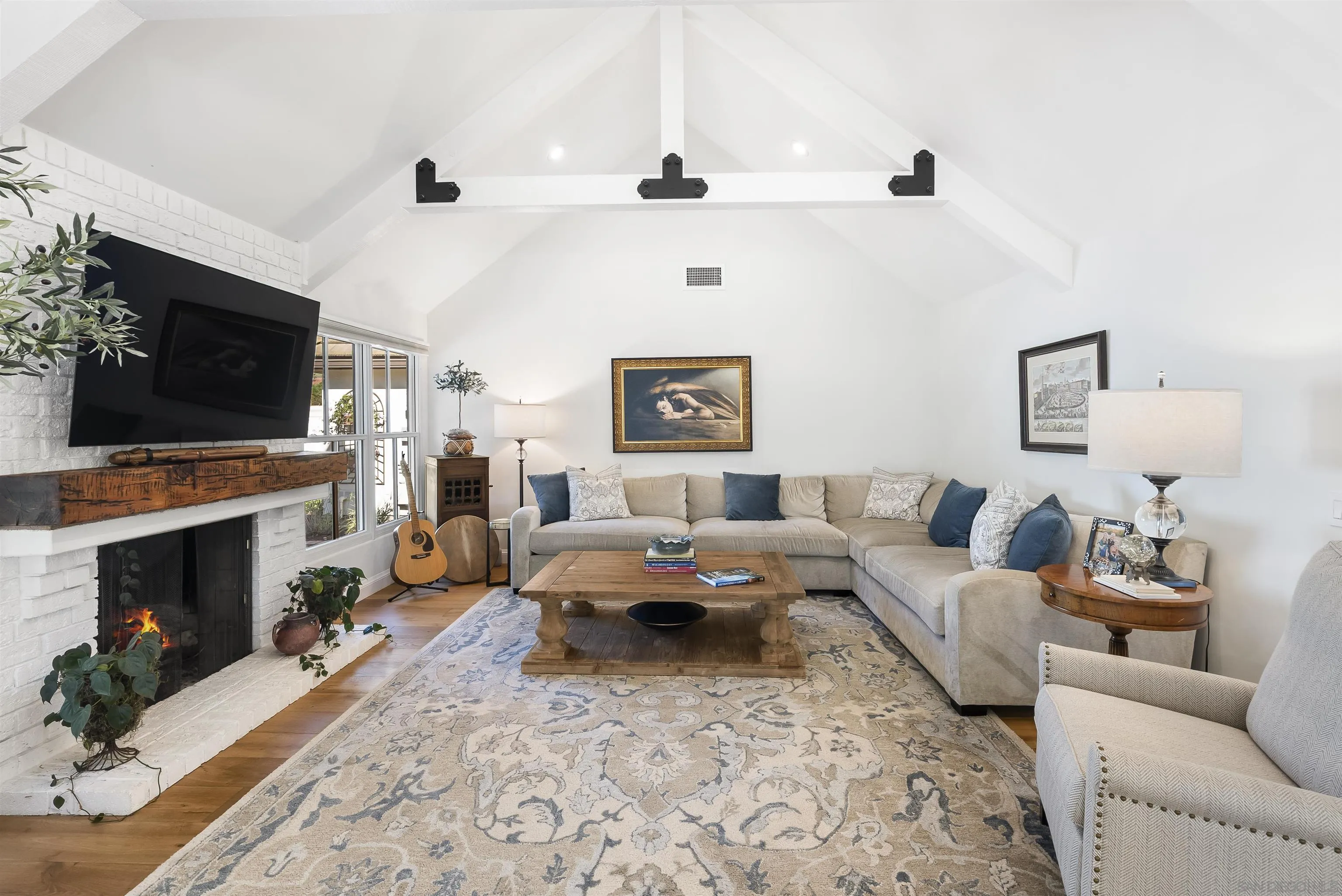 5 Country Glen Road Fallbrook, CA 92028 - Photo 20 of 43 a living room with furniture a flat screen tv and a fireplace
