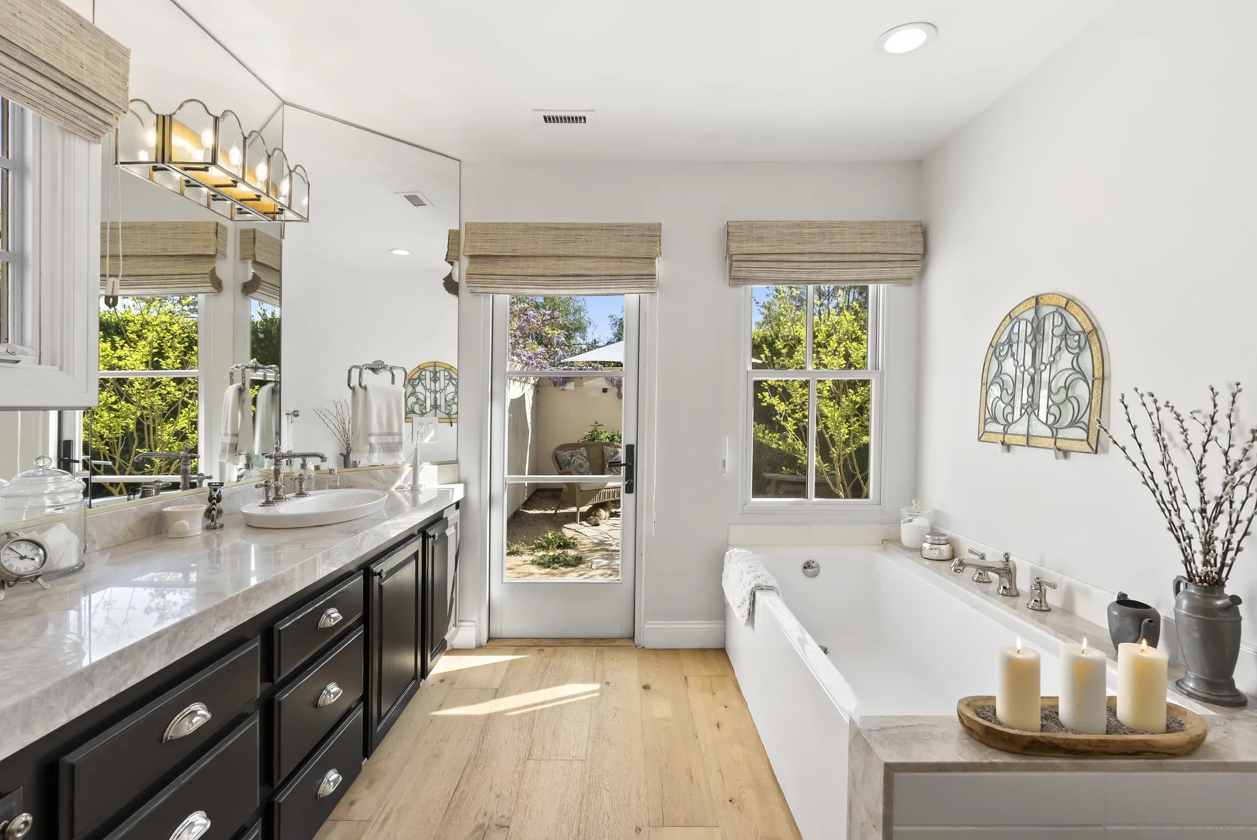 5 Country Glen Road Fallbrook, CA 92028 - Photo 25 of 43 a spacious bathroom with double vanity a mirror a bathtub and a shower