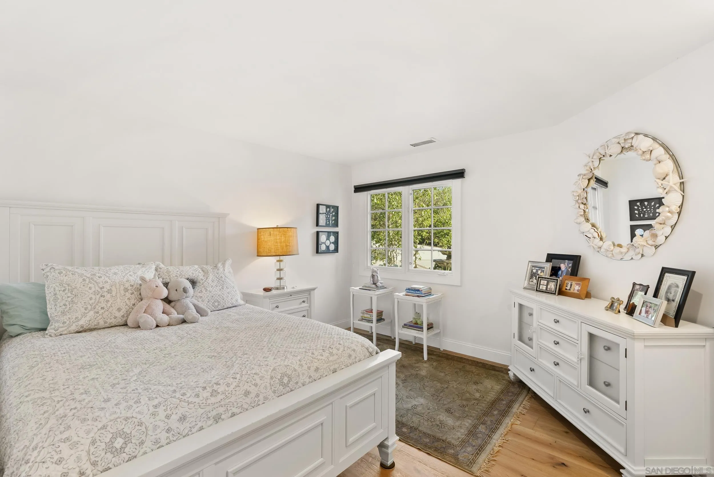 5 Country Glen Road Fallbrook, CA 92028 - Photo 27 of 43 a bedroom with a bed and a chandelier