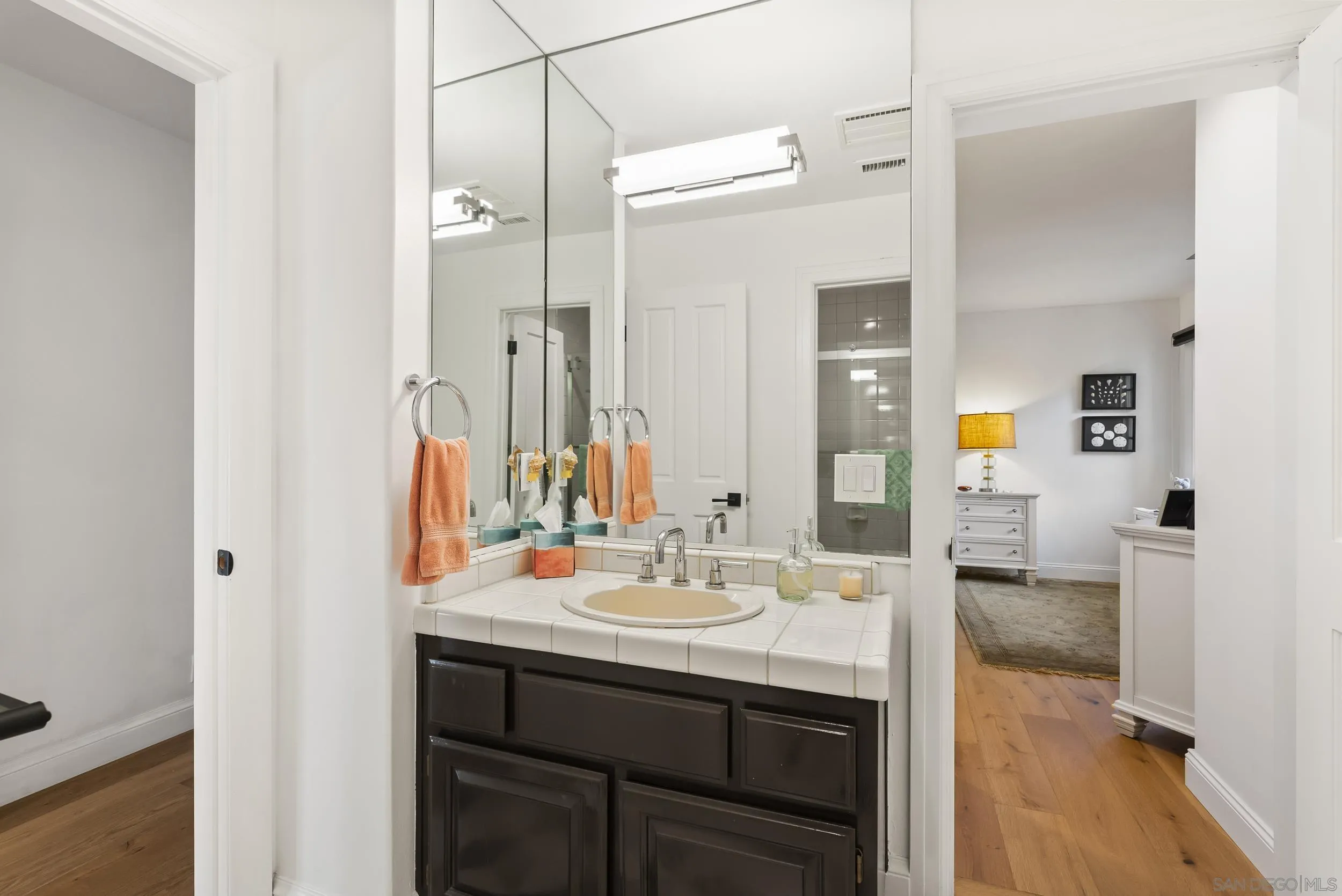 5 Country Glen Road Fallbrook, CA 92028 - Photo 28 of 43 a bathroom with a sink a mirror and a shower