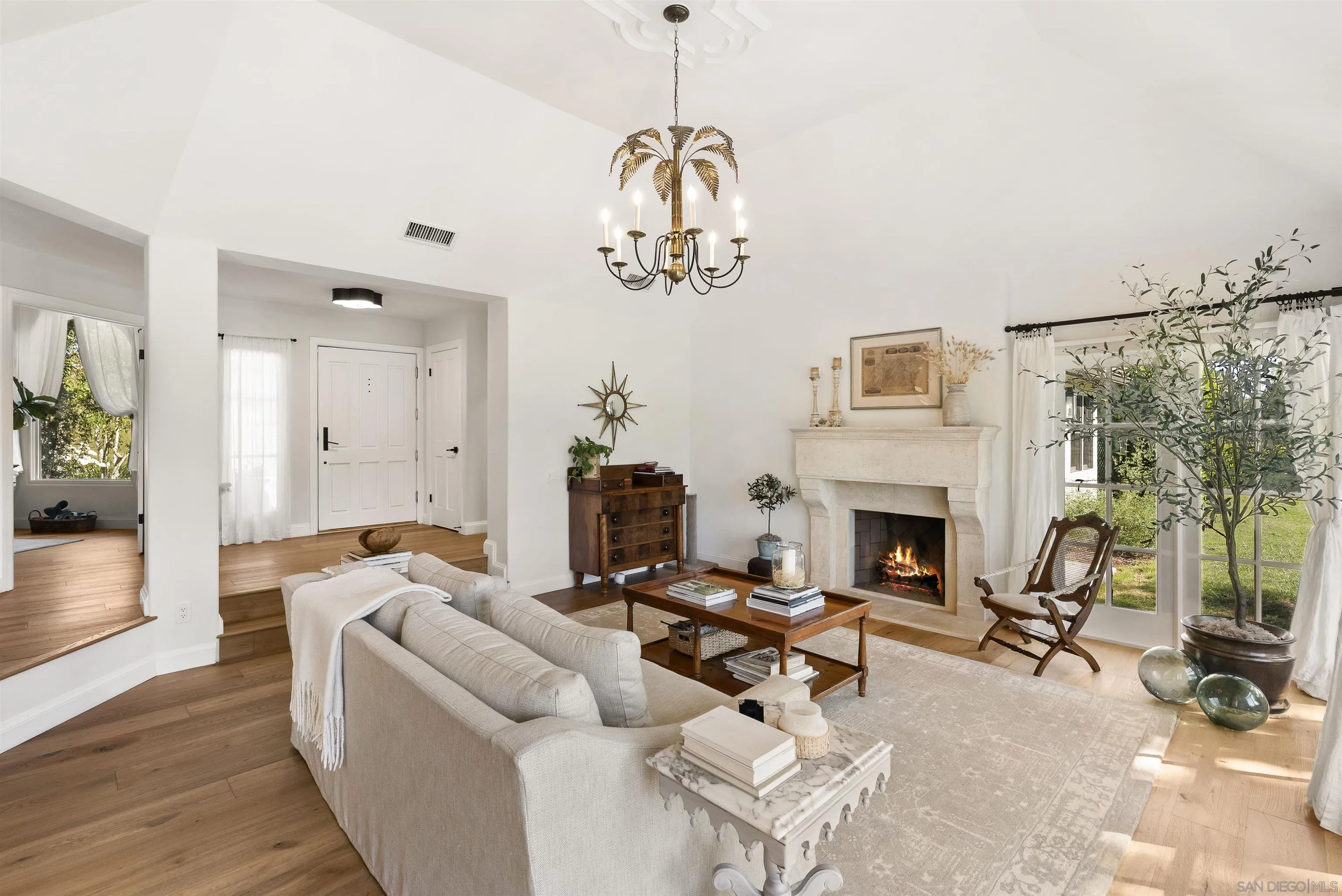 5 Country Glen Road Fallbrook, CA 92028 - Photo 9 of 43 a living room with furniture a fireplace and a chandelier