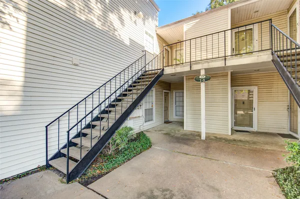 a view of a house with wooden stairs