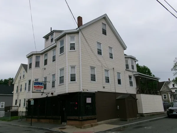 a view of a white building among the street
