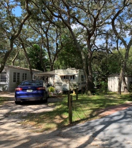 3000 Clarcona Road, Unit 359 Apopka, FL 32703 - Photo 1 of 1 a front view of a house with a garden