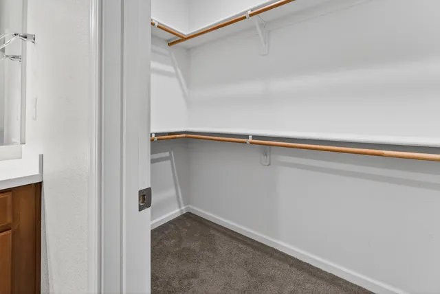 a kitchen with stainless steel appliances kitchen island granite countertop a stove and a sink