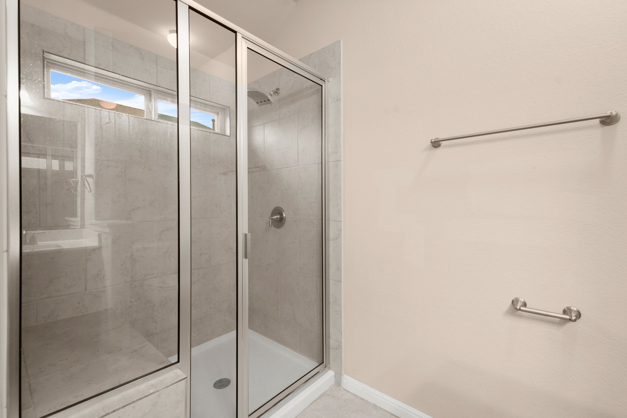 305 Longhorn Cavern Road Leander, TX 78641 - Photo 12 of 21 The primary bath also features a spacious walk-in shower with clean tiling.