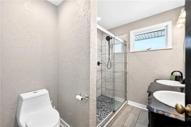 a bathroom with a toilet and a sink