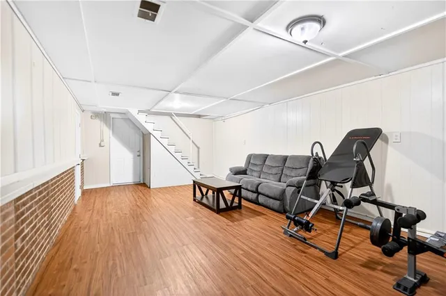 a view of a workspace with wooden floor