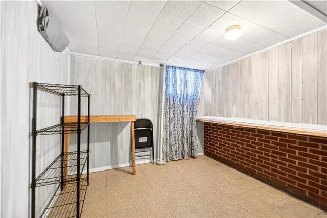 a view of staircase with white walls and a window