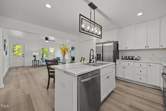 a kitchen with cabinets and window
