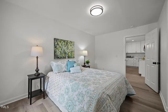 a bedroom with a bed and a lamp