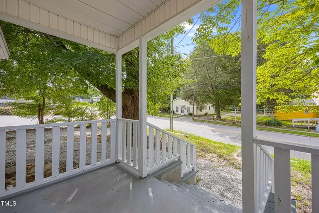 a view of a balcony with lake from a balcony