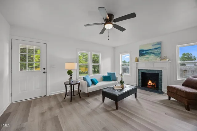 a living room with furniture and a fireplace