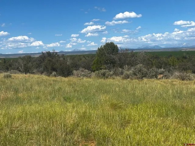 a view of a lake and mountain view in back