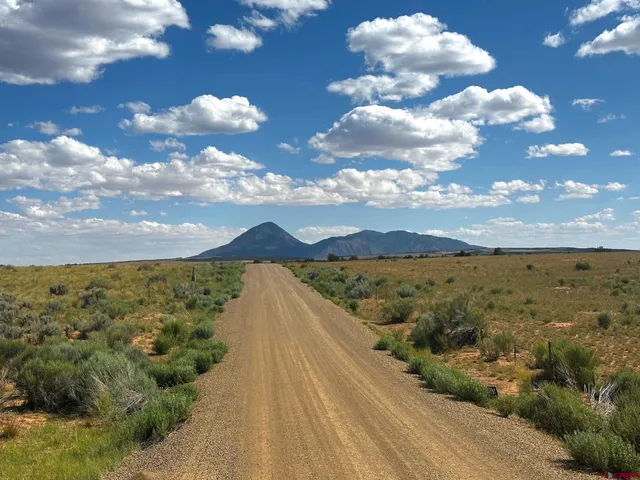 a view of swimming pool and mountain in the background