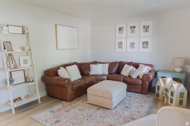 1204 North 3020th Street West Provo, UT 84601 - Photo 11 of 35 Formal living area featuring light wood-finish flooring and neutral wall tones, next to entrance