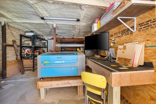 a view of a yard with wooden fence