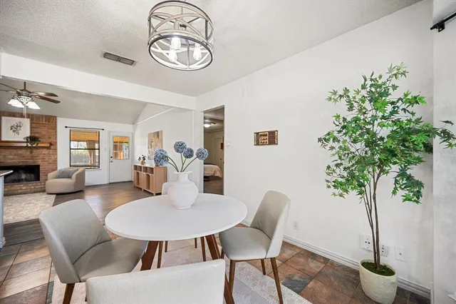 a view of a livingroom with furniture and a table
