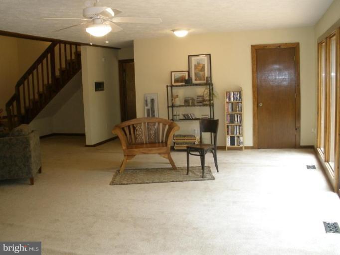 12585 Hunt Road Culpeper, VA 22701 - Photo 8 of 20 LARGE ,OPEN LIVING ROOM WITH SLIDING DOORS