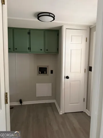 a view of a utility room with closet