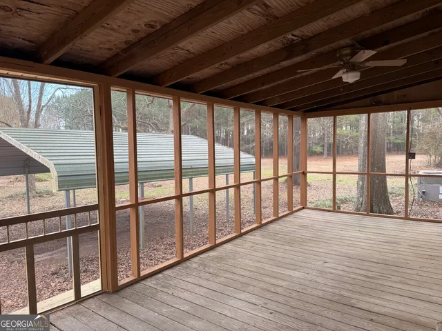 a view of hallway with wooden floor