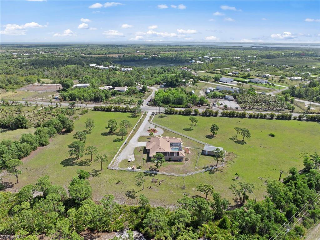 13541 Stringfellow Road Bokeelia, FL 33922 - Photo 44 of 49 a view of a lake with a yard