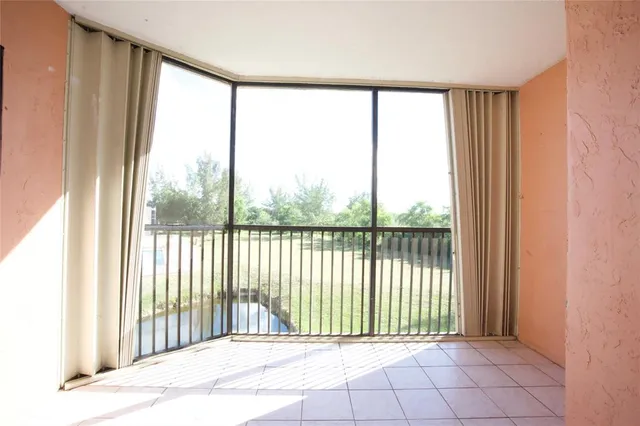 a view of a room with large windows