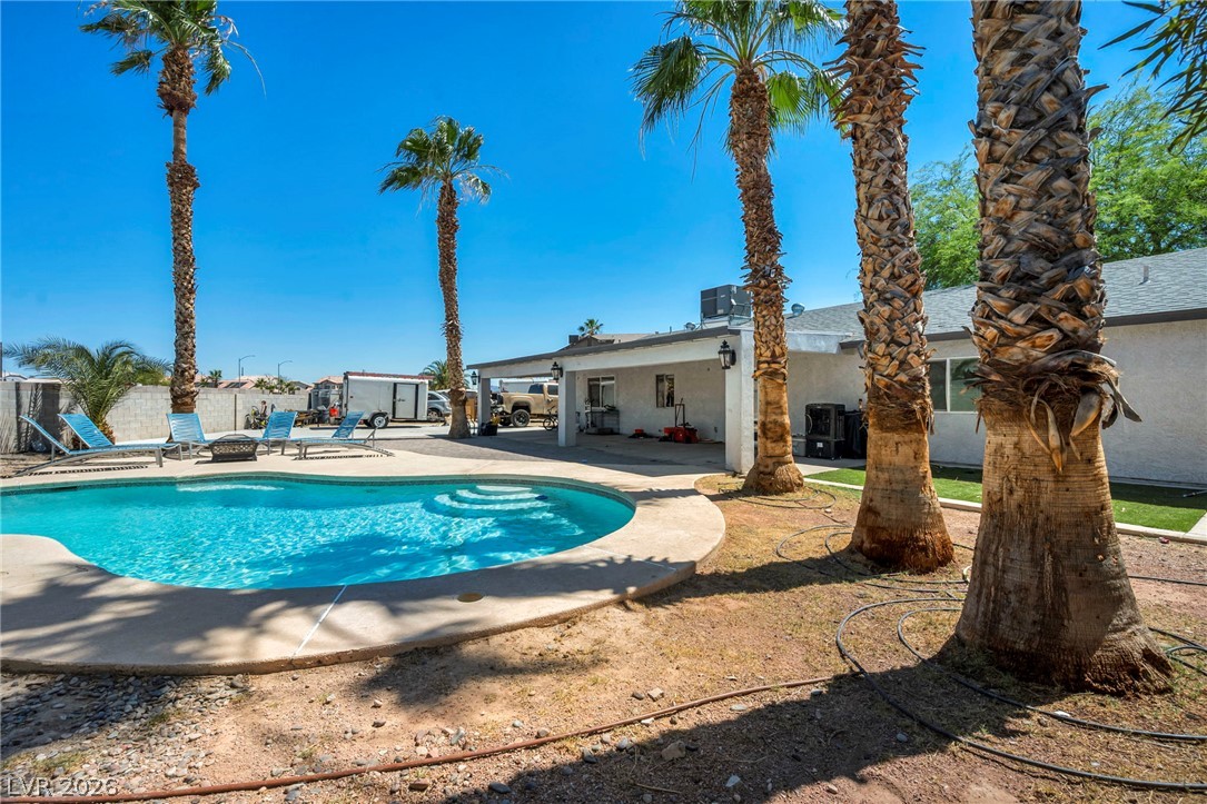 5882 Rio Tinto Way Las Vegas, NV 89110 - Photo 53 of 56 A private backyard oasis awaits, complete with a refreshing pool and shaded patio.