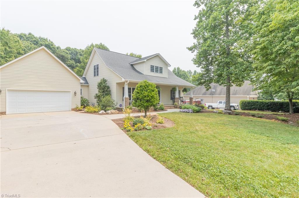 961 Griffin Road Stokesdale, NC 27357 - Photo 2 of 50 View of garage and front porch