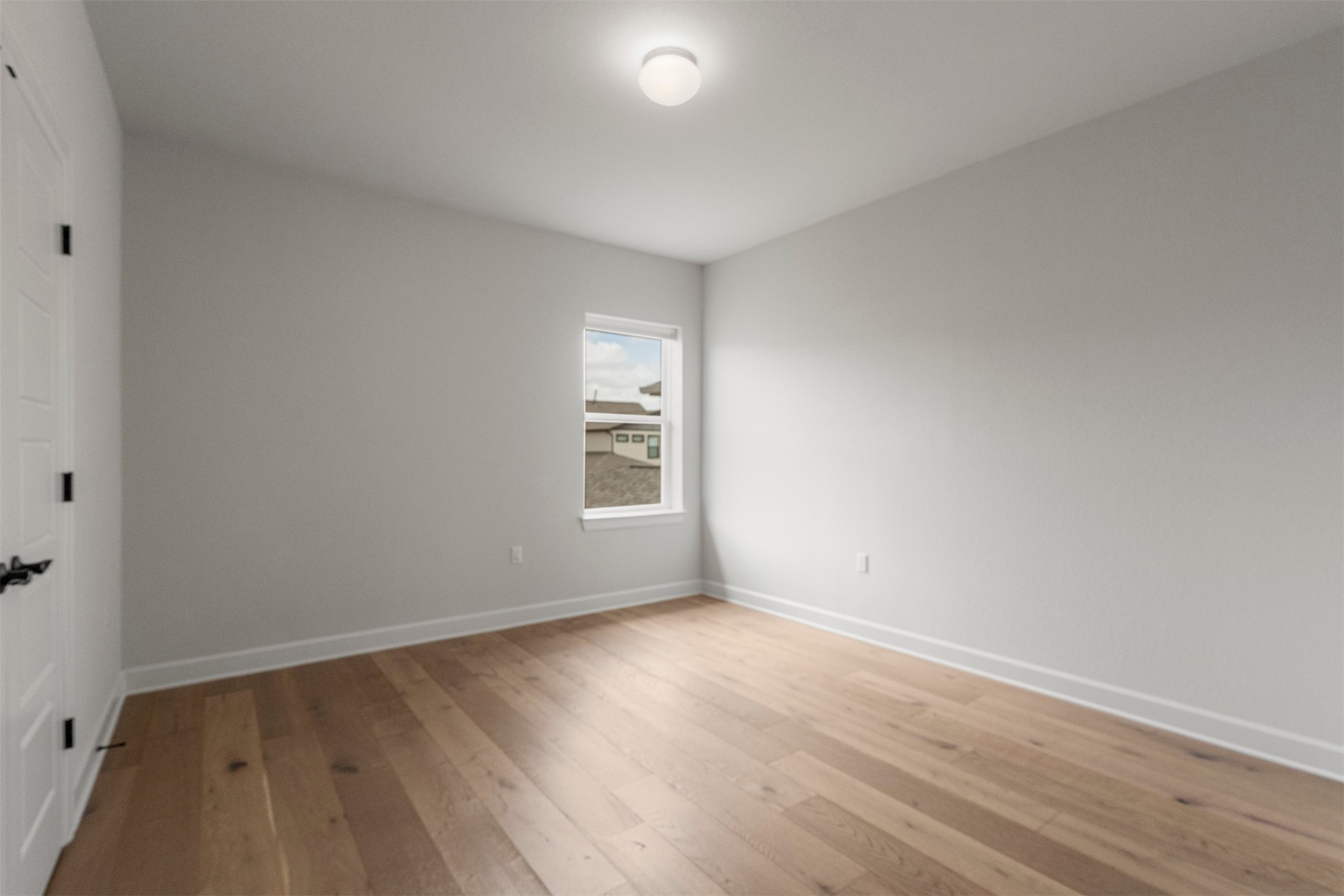 4313 Vaughan Street Austin, TX 78723 - Photo 28 of 39 The first of two extra-large upstairs bedrooms, this space offers generous dimensions and the same beautiful hardwood flooring
